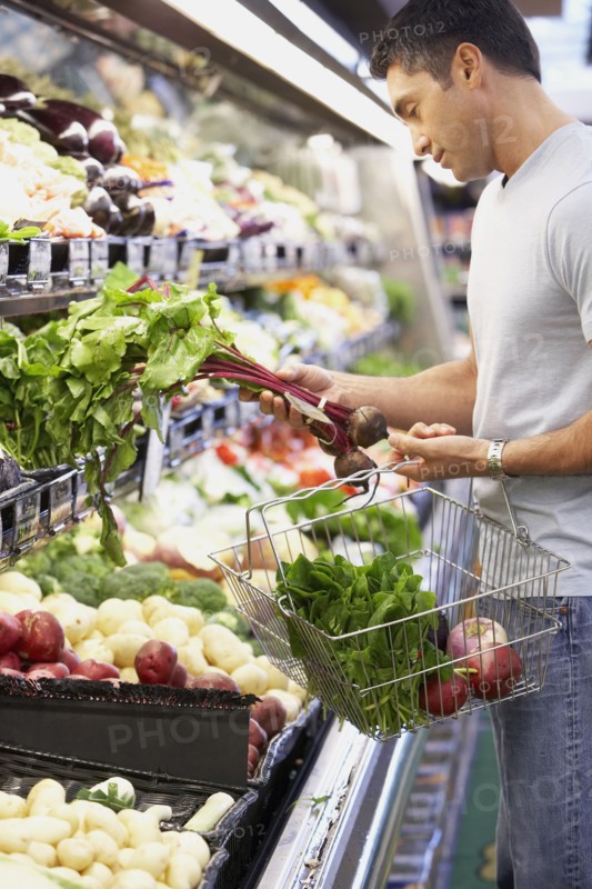 Hispanic man shopping for produce