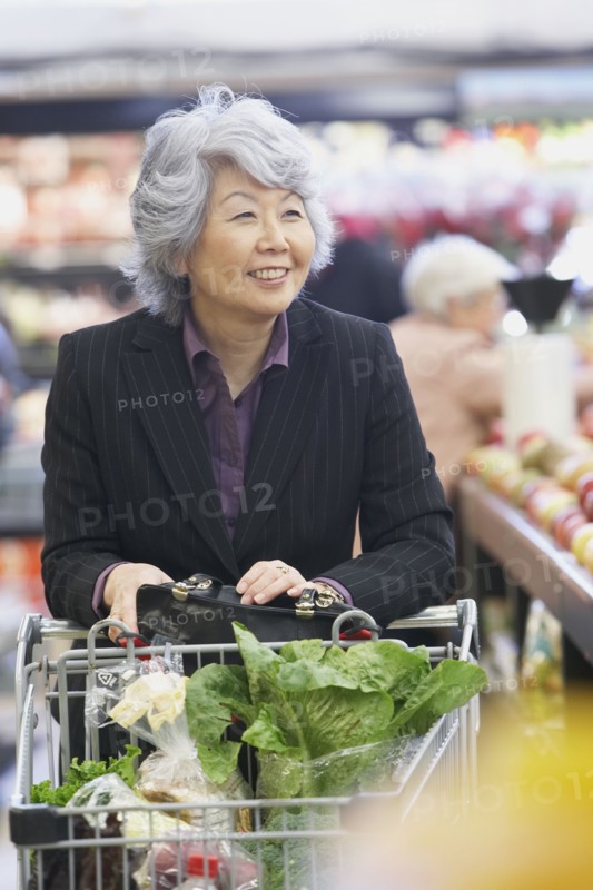 Senior Asian woman in grocery store