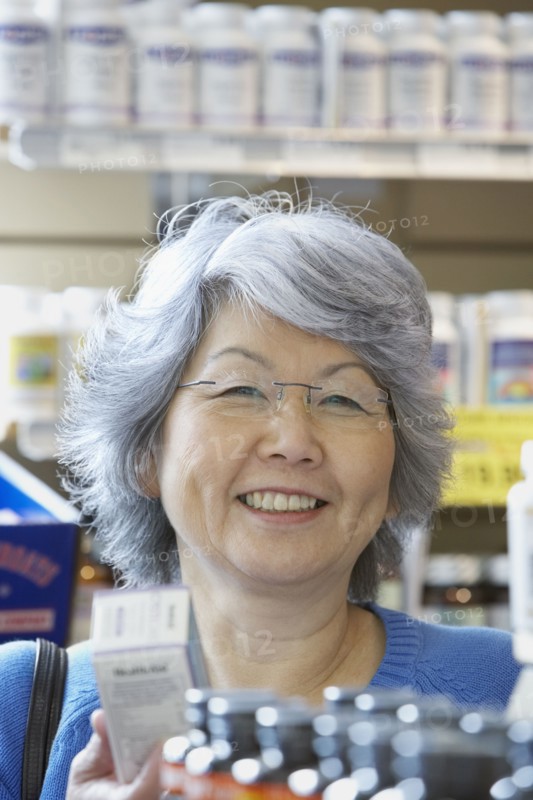 Senior Asian woman shopping for vitamins