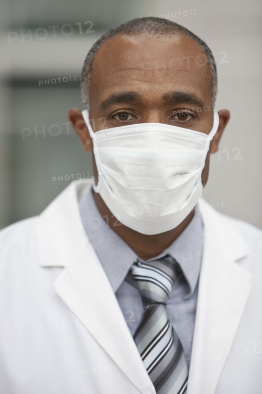 Mixed race doctor wearing surgical mask