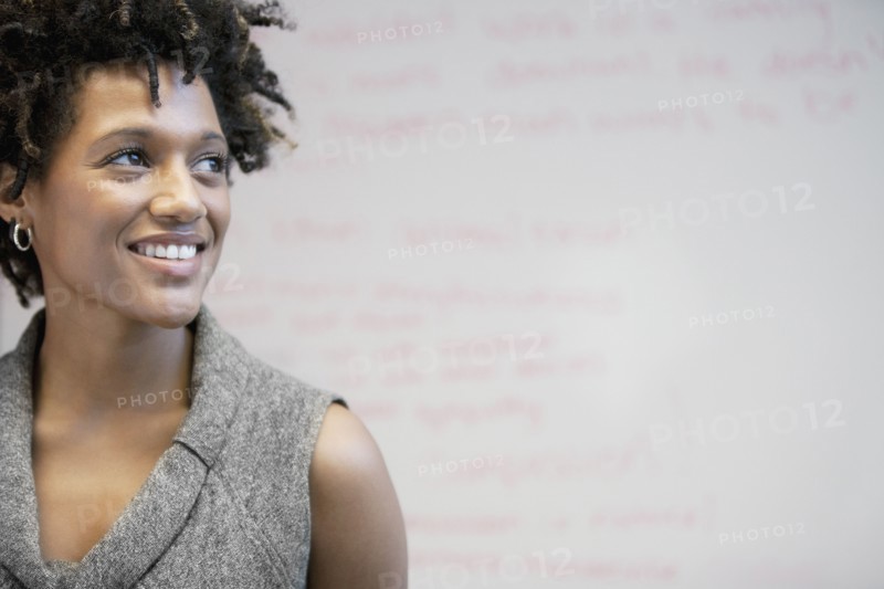 Smiling mixed race businesswoman