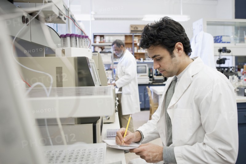 Middle Eastern scientist working in laboratory