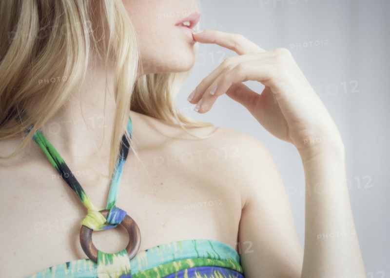 Close up profile of woman touching her lips