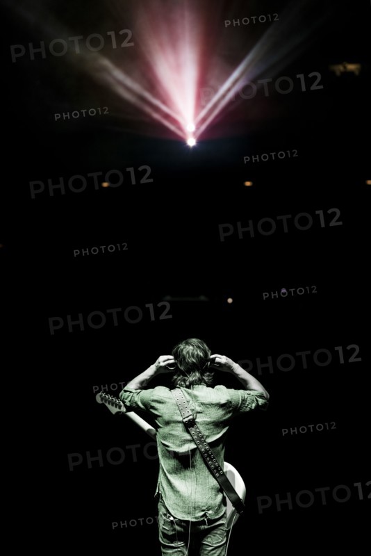Rear view of musician standing onstage