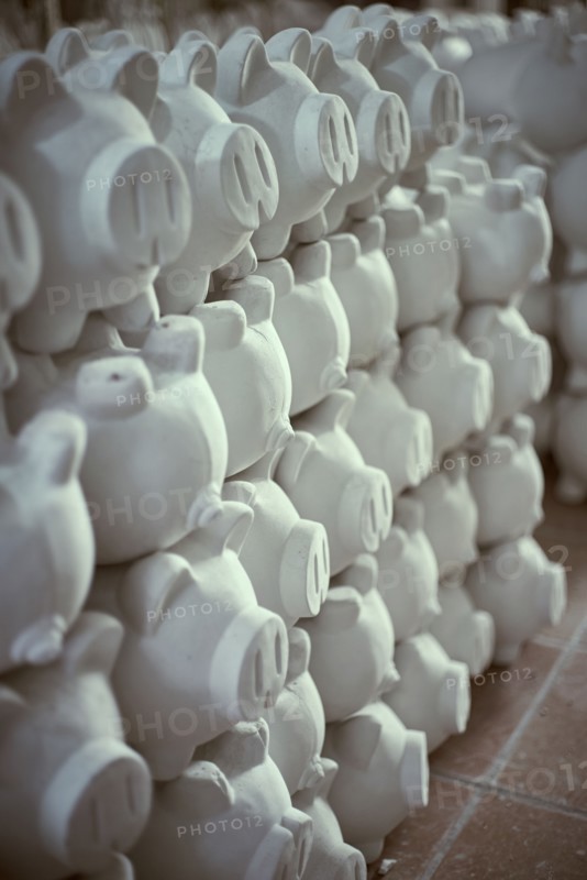 Pile of white piggybanks