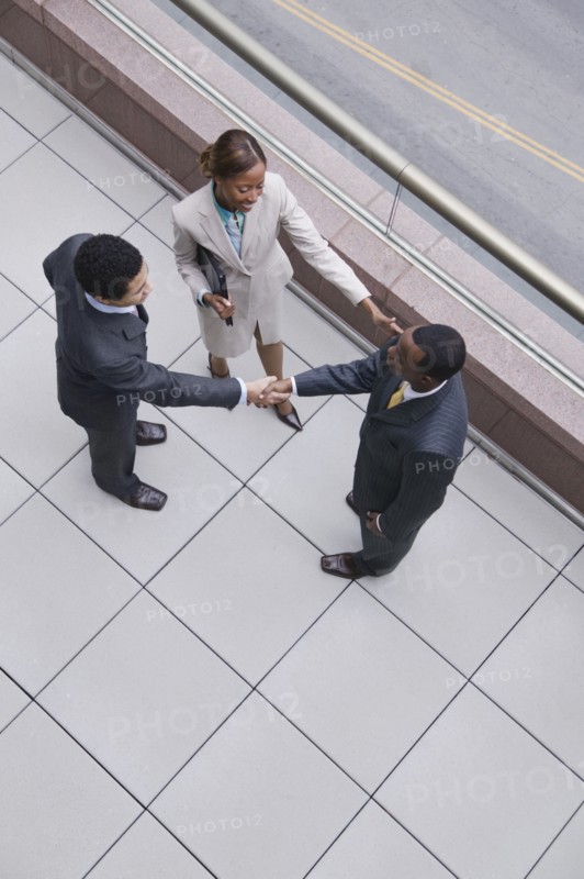 Multi-ethnic business people shaking hands