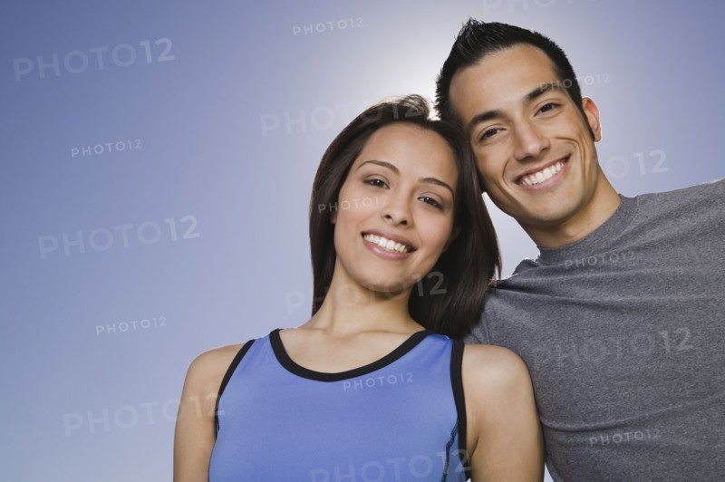Confident Hispanic couple smiling