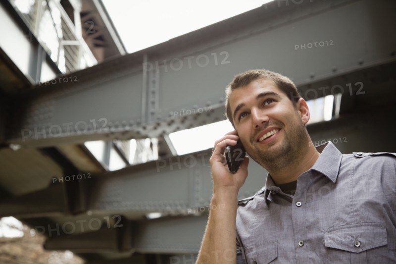 Hispanic man talking on cell phone
