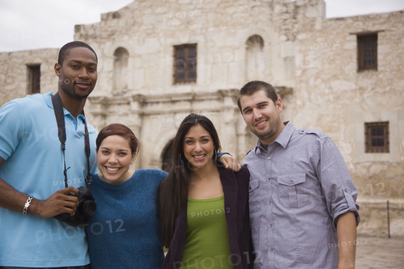 Smiling couples at tourist attraction