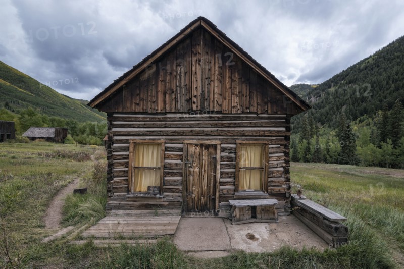 Rustic log cabin in valley