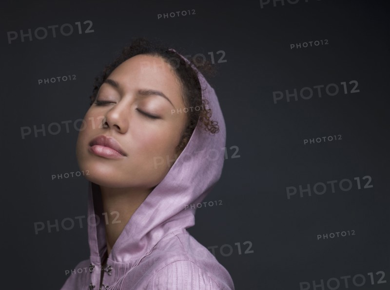 Mixed Race woman wearing hooded shirt
