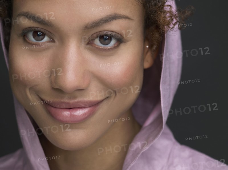 Mixed Race woman wearing hooded shirt