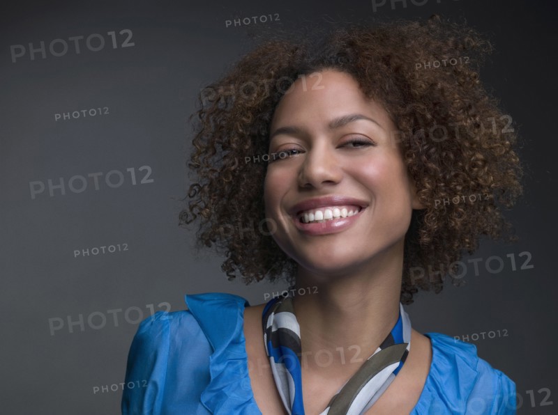 Mixed Race woman wearing scarf around neck