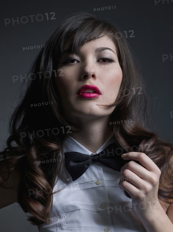 Mixed Race woman wearing bowtie
