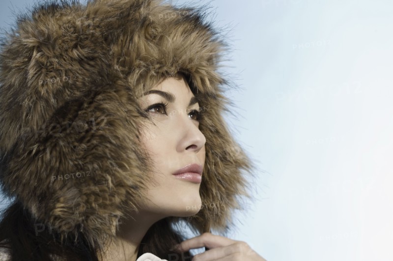 Mixed Race woman wearing fur hat