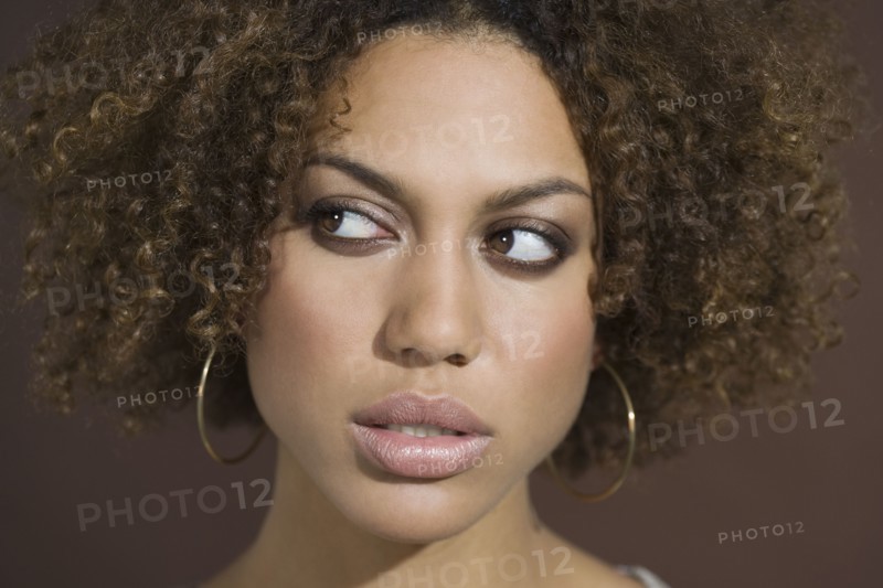 Mixed Race woman looking sideways