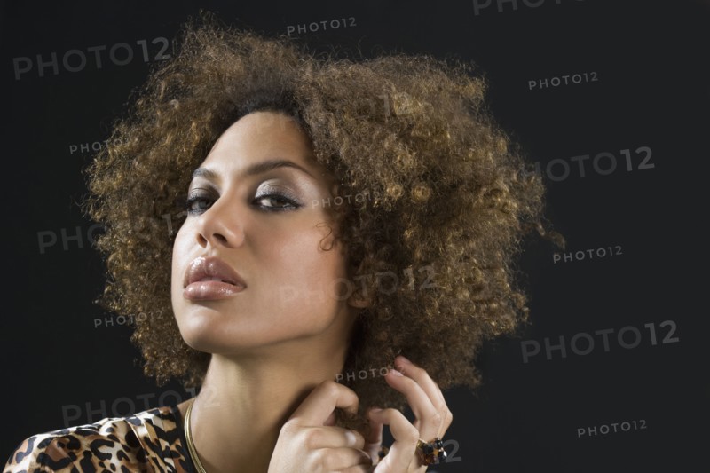 Mixed Race woman pulling hair