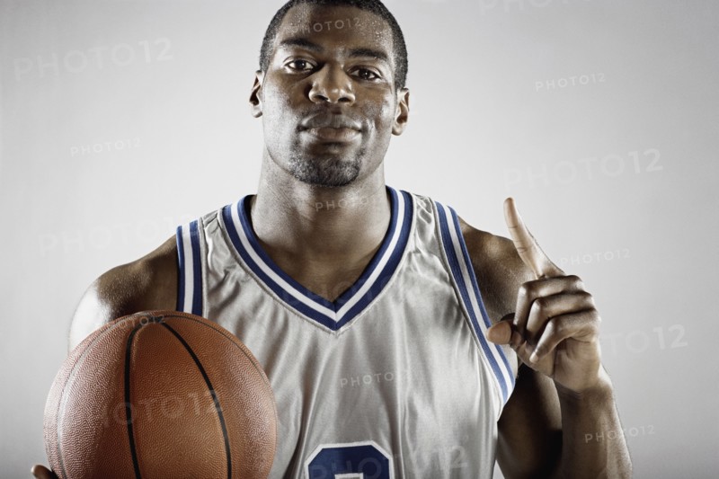 African basketball player holding basketball