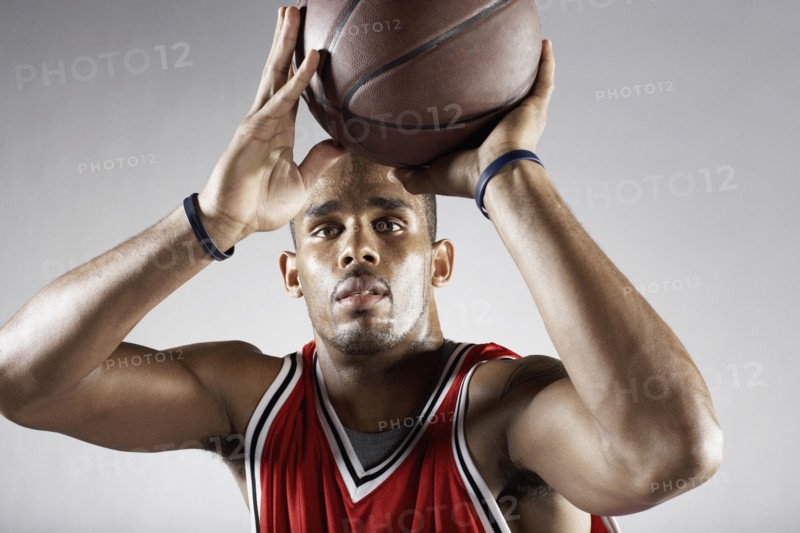African basketball player shooting basketball