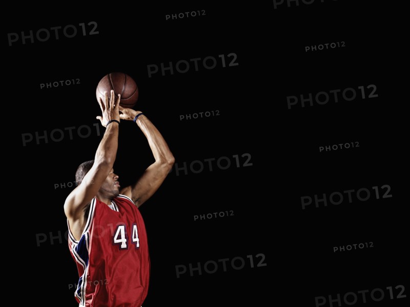 African basketball player shooting basketball