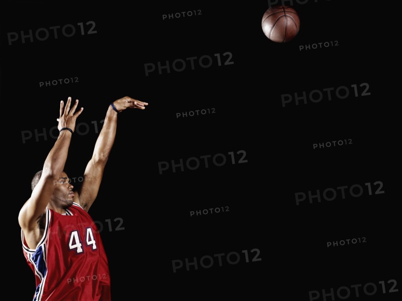 African basketball player shooting basketball