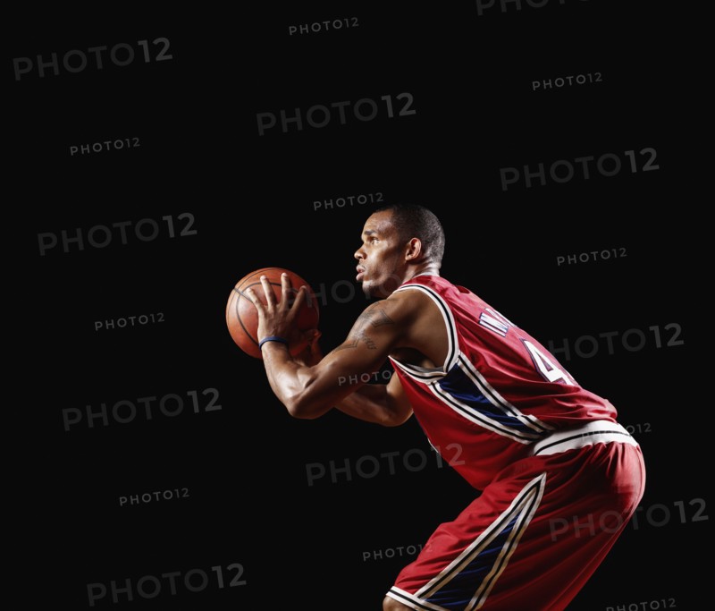African basketball player shooting basketball