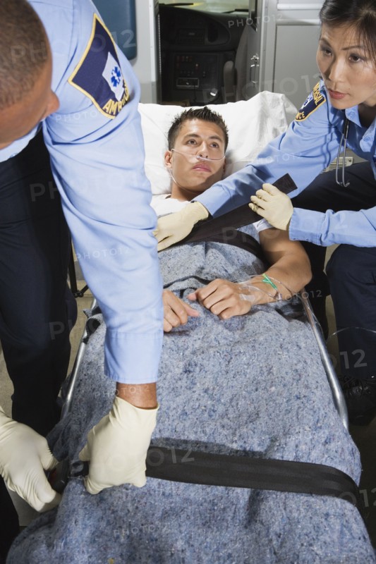 Man in ambulance with paramedics