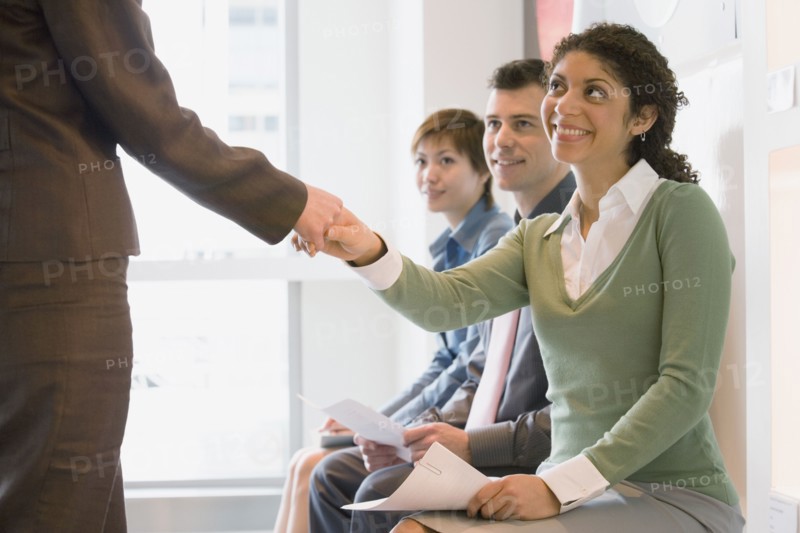 Young businesswoman shaking hands