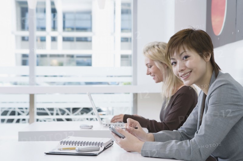 Multi-ethnic businesswomen in cafe