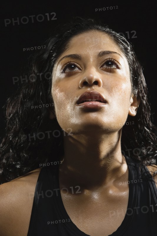 Sweaty Indian woman in athletic gear