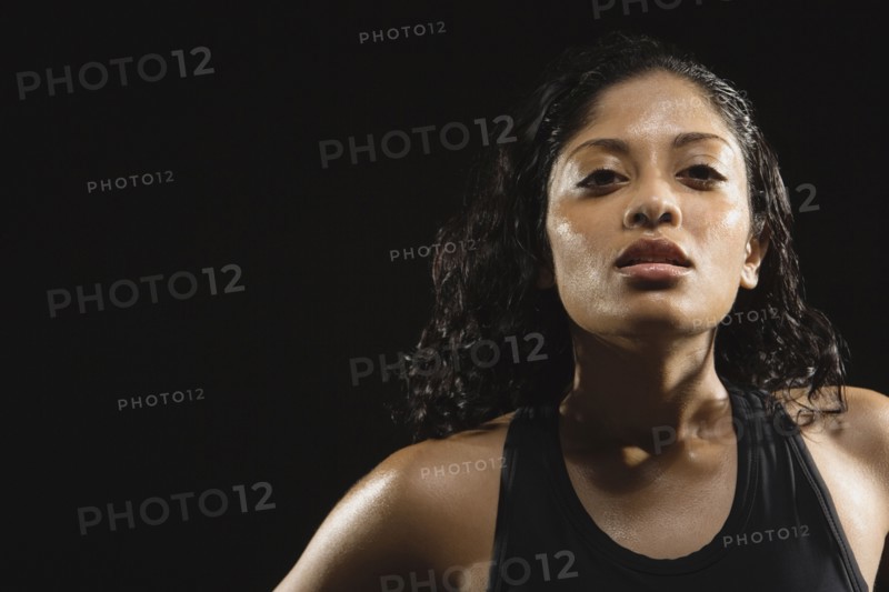 Sweaty Indian woman wearing tank top