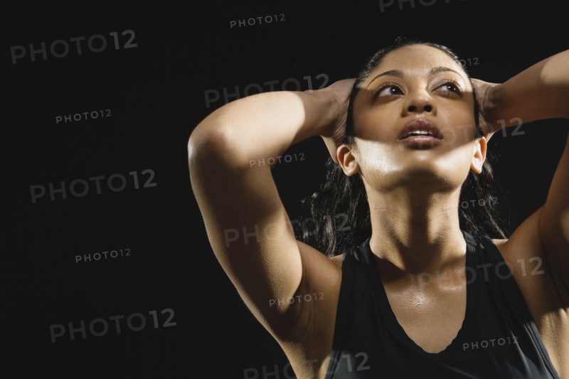Indian woman pushing hair back