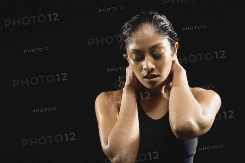 Indian woman with hands in hair