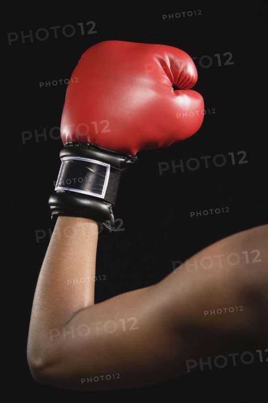 African American woman wearing boxing glove