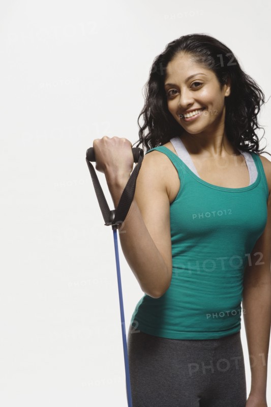 Indian woman using exercise band