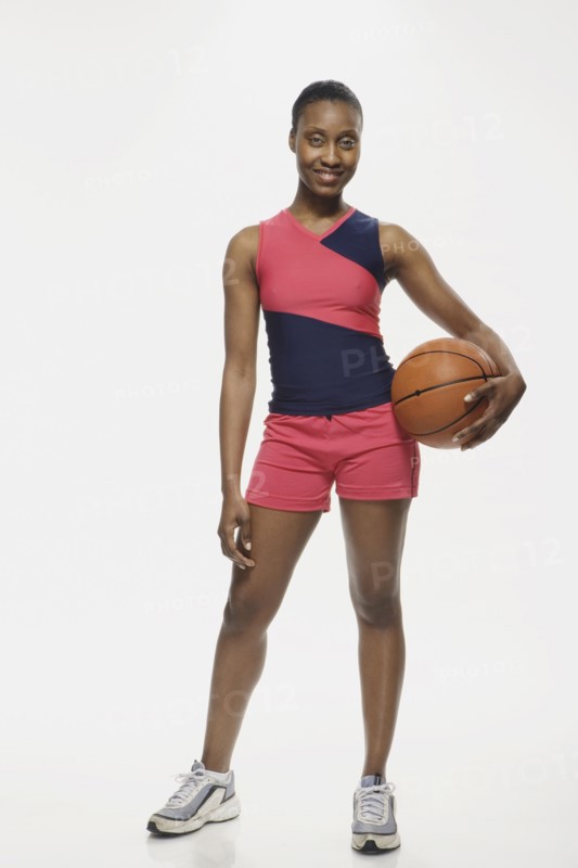 African American woman holding basketball