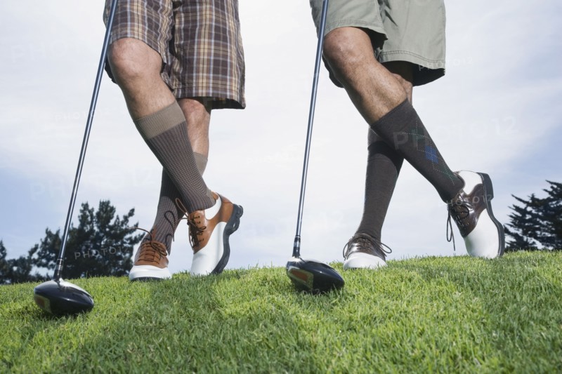 Multi-ethnic men on golf course