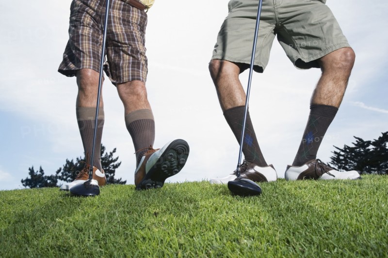 Multi-ethnic men on golf course