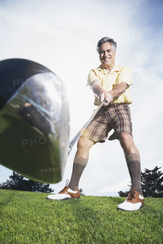 Man swinging golf club