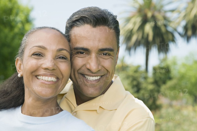Multi-ethnic couple hugging