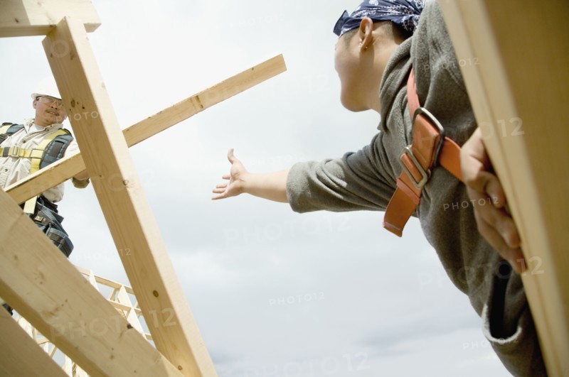 Construction workers building house
