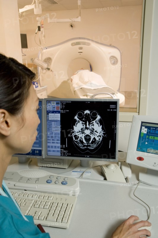 Chinese technician checking MRI results in hospital