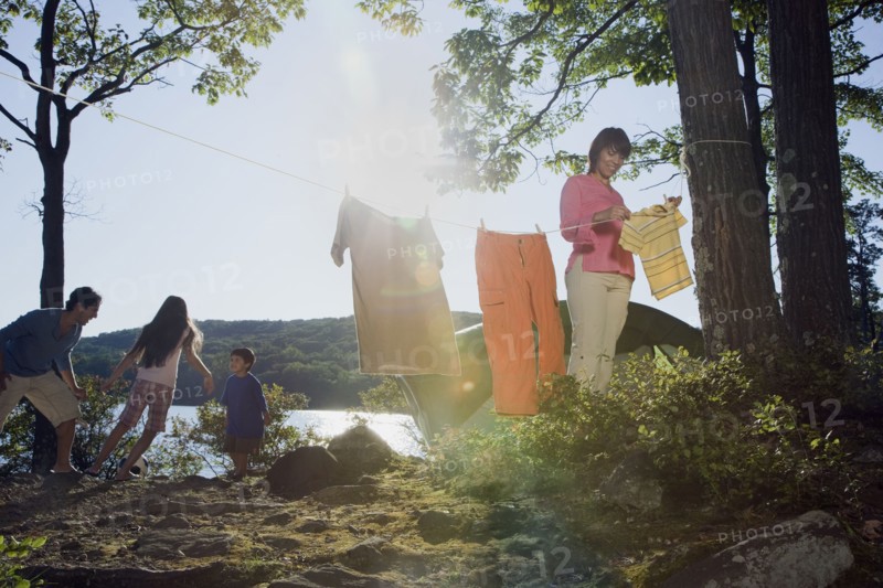 Family camping by lake