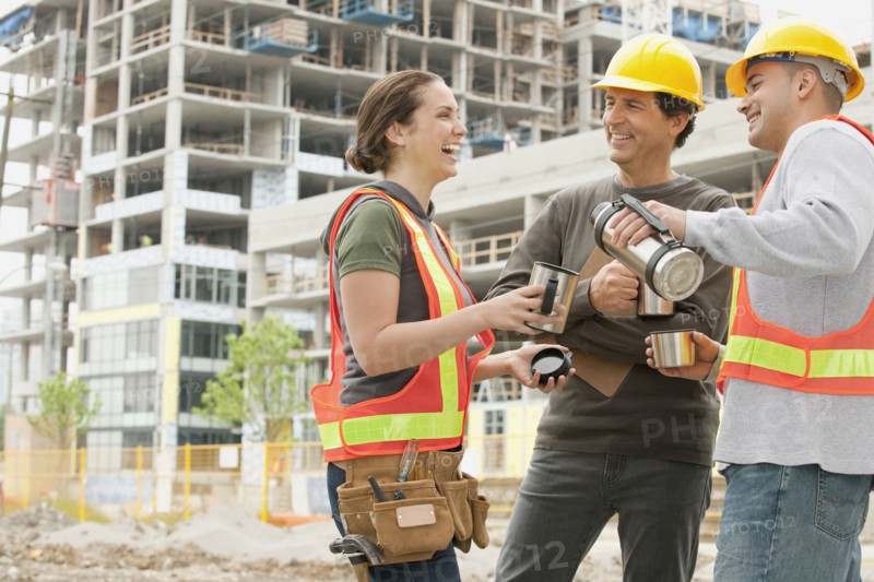 Construction workers on construction site drinking coffee