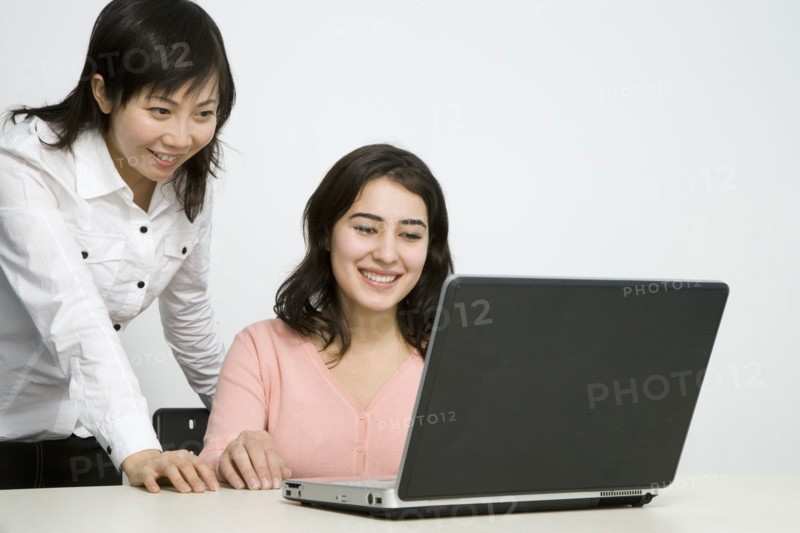 Chinese businesswomen working together