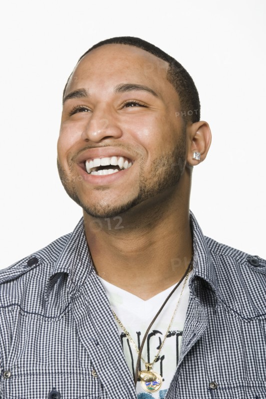 Hispanic man looking up and laughing