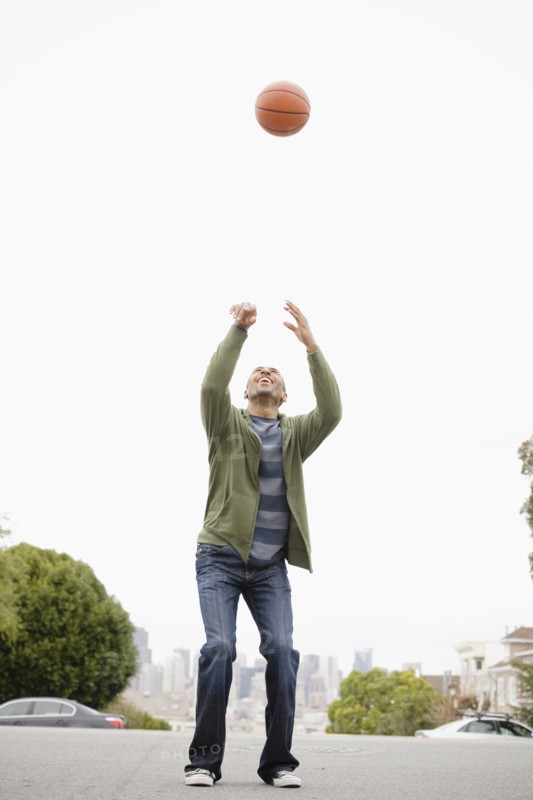 African American man playing basketball