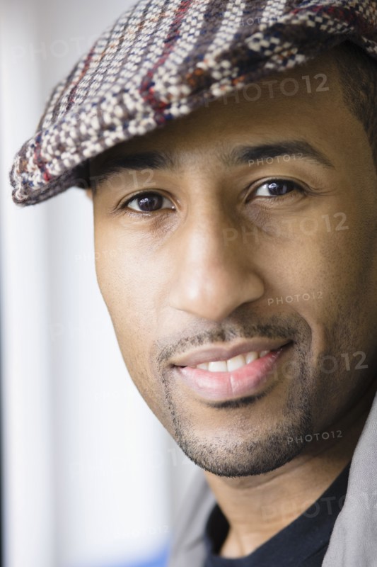 African American man wearing cap