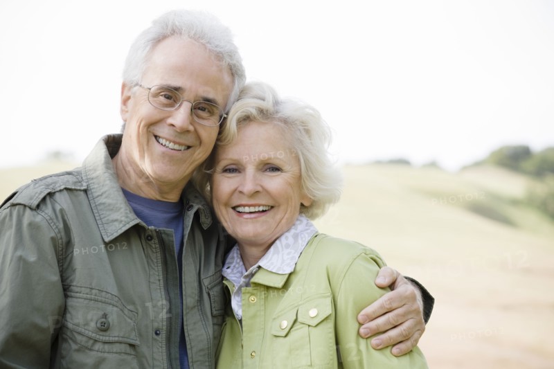 Caucasian couple hugging outdoors