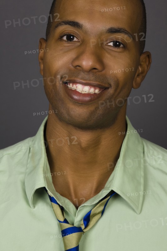 Smiling African American man wearing braces